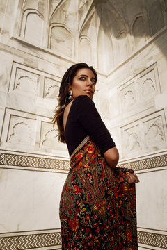 beautiful indian woman in sari in agra at taj mahal