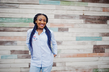 Stylish african american girl with dreads outdoor.