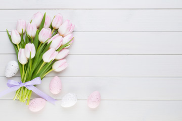 Pink tulip on the white background. Easter background.