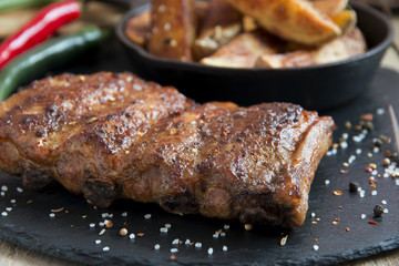 fried roasted pork ribs with potatoes and spices
