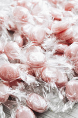 Pile of small pink sugar candies 