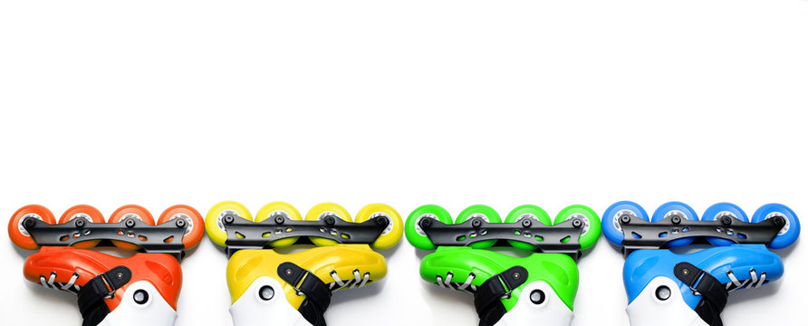 Long banner colored roller skates on isolated white background