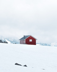 Typical norwegian red wooden house near famous Aurlandsvegen (Bjorgavegen) mountain road in Aurland, Norway in summer time
