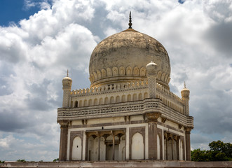 Fototapeta na wymiar Qutb Shai tombs in Hyderabad India on a sunny day with large clouds in the background