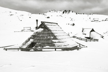 Traditional cottages on Velika planina in winter, Slovenia