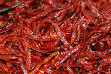Red hot shiny chili peppers in bulk in the market