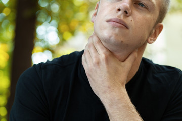 Fototapeta premium Young man with sore throat