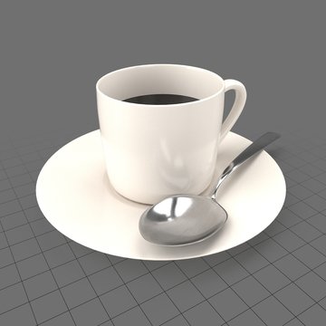 Full coffee cup with spoon