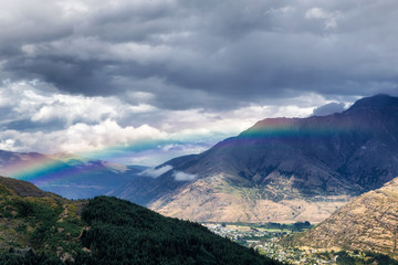 Fototapeta na wymiar Rainbow in the mountains of Queenstown, South Island, New Zealand