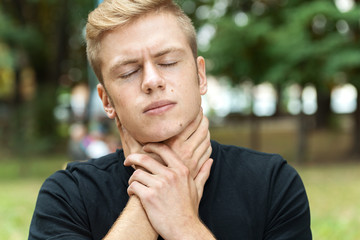 Young man with sore throat