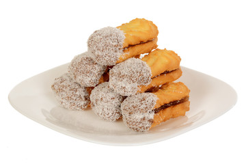Sandwich cookies with coconut, oval shape filled with chocolate cream