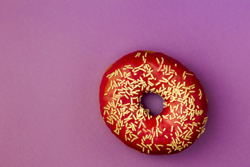 punchy red donut on pastel background