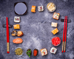Fototapeta na wymiar Sushi and roll set on black table