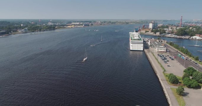 Ferry in the dock port Riga city Dugava river and il city Drone Flight yacht