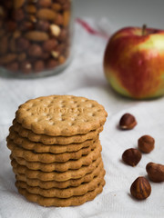 stack of biscuits with hazelnuts and apples