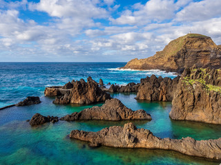Fototapeta na wymiar Natural swimming pools on volcanic region of Porto Moniz in Madeira island, Portugal