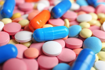 Many colorful pills as background