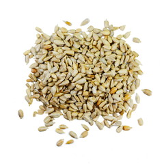 Heap of hulled sunflower seeds, on white background