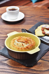 Meat pastry with coffee on wooden table             