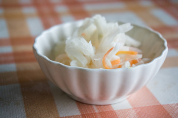 japanese's style pickles in white bowl.