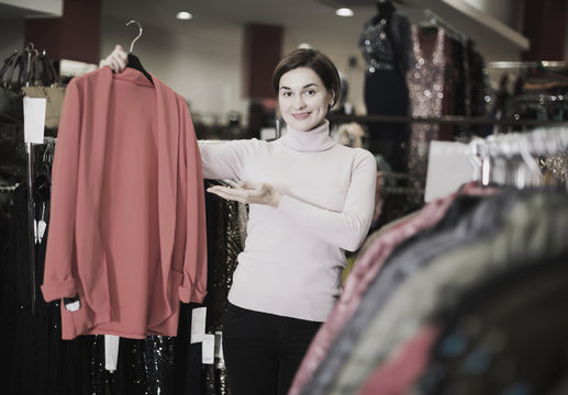 Woman choosing knitwear cardigan