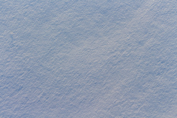 Texture of snow in blue light