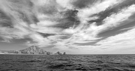 Lands End as seen from the Pacific Ocean at Cabo San Lucas in Baja California Mexico BCS - black and white