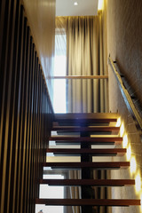 Wooden stairway with under light for safety in the night 