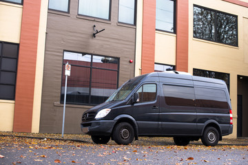Commercial cargo mini van for small business and local delivery stand on the urban city street at industrial zone © vit