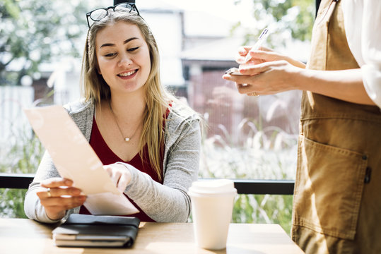 Woman ordering food at the restaurant