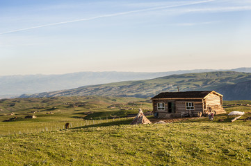 Wooden house in the grassland, Xinjiang of China