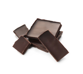 Pieces of dark chocolate on white background