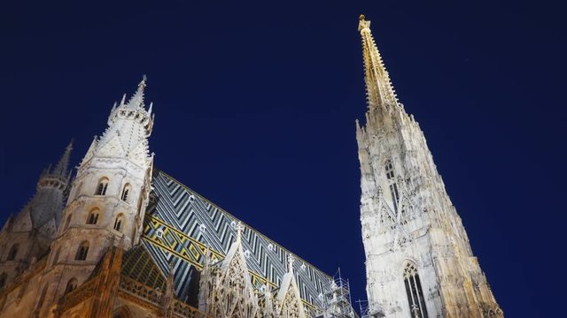 an ultra wide night shot of st stephen's cathedral in vienna, austria