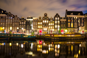 Fototapeta na wymiar Night scene in one of the multiple canals in Amsterdam