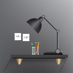 Black lamp turn off on a black working table with a three pencils such as green,red,yellow in a mini stainless cylinder and white sticky notes as write a message that 9am. and 2pm. stick on a grey wal