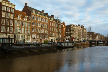 Historic buildings over the canals in the Old Town of Amsterdam. Netherlands