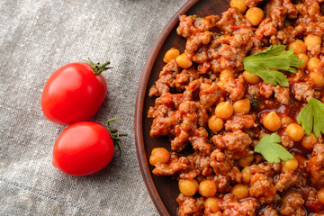 Mexican chilli with chickpeas in a clay plate