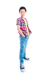 Fototapeta premium Full length of young asian boy standing over white background