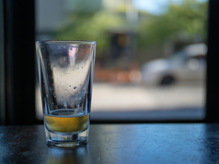 Empty glass of beer in a dark bar