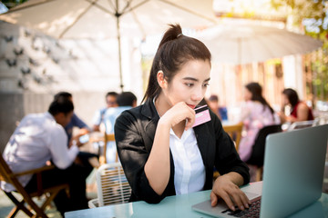 Busy young business woman working on desk