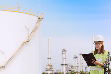 Young asian architects team on construction site check documents plan on construction site at sunrise,teamwork,construction concept.