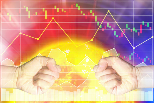 Trade war crisis problem between two big country cause global economic impact by dropping stock index market.The image shown two hands punch on heat graph background.Sun image furnished by NASA.