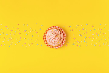 Cupcake, confetti background.