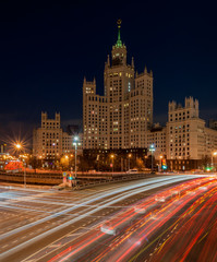 Fototapeta na wymiar Evening traffic on the background of a skyscraper on Kotelnicheskaya Embankment 