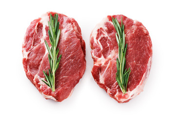 Fresh raw pork steaks and rosemary isolated on white background.