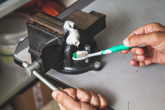 squeezes toothpaste from tube with vise