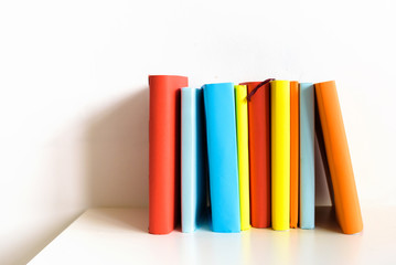 Fototapeta na wymiar Multi-colored books on a white background