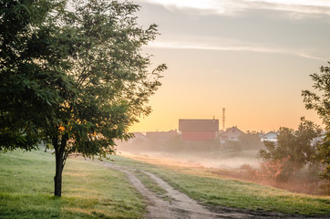 Fototapeta premium Novi Sad, Serbia - October 22, 2015: Sunrise over the entry to the village 