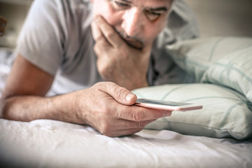 Mobile phone in bed.