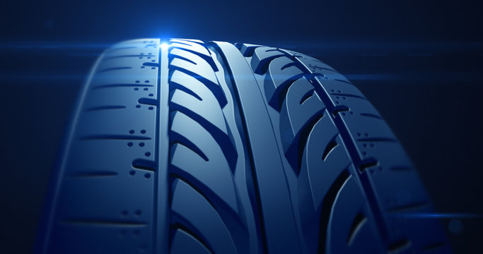 Close up car tire with depth of field and lens flare
